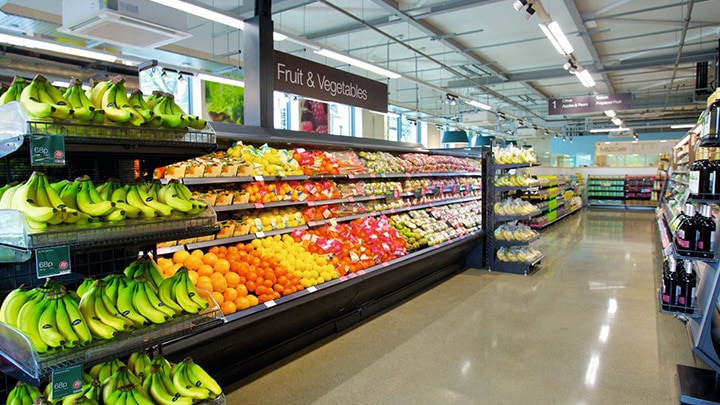 A well-stocked fresh fruit and vegetables section of an Albert Heijn supermarket. - smart retail lighting