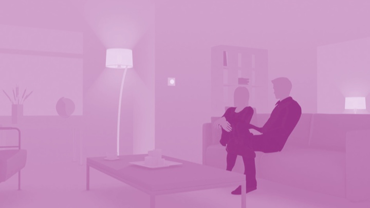 Visualization of a couple sitting on the couch at home enjoying LED lighting