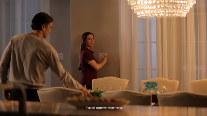 Lady using a dimmer switch to change the ambiance in a room